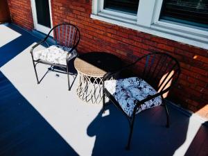 two chairs and a basketball hoop on a patio at Private 3 Bdrm Apt Spacious And Convenient in Pittsburgh