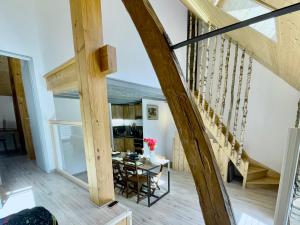 a view of the dining room and living room of a house at Eth Paon in Saint-Mamet