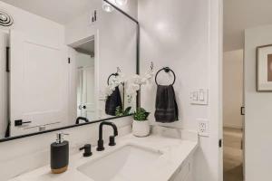 a white bathroom with a sink and a mirror at Luxury Condo In Old Town Scottsdale Wpool in Scottsdale +14 photos
