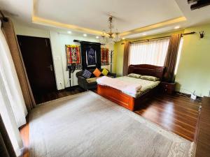 Tempat tidur dalam kamar di SiddhiNiwas