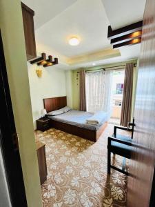 Tempat tidur dalam kamar di SiddhiNiwas