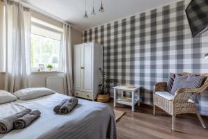 Posteľ alebo postele v izbe v ubytovaní Ceynowa Gdańsk Brzeźno