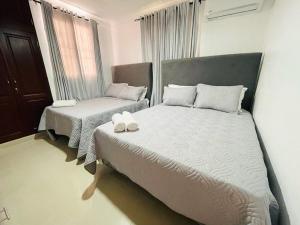 Postel nebo postele na pokoji v ubytování Casa Las Guilas