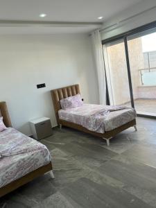 Ένα ή περισσότερα κρεβάτια σε δωμάτιο στο Villa - Tunisie Djerba +27 φωτογραφίες