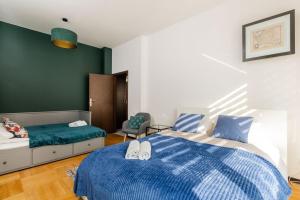 Posteľ alebo postele v izbe v ubytovaní Peanut Premium Apartment Ochota