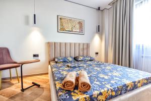 Ένα ή περισσότερα κρεβάτια σε δωμάτιο στο Aisulu - апартаменты в центре города - выбор для туриста и деловых поездок