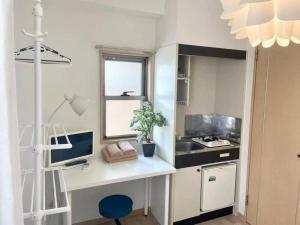 Kuchyň nebo kuchyňský kout v ubytování シャンテ高田馬場32