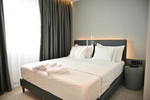 Postel nebo postele na pokoji v ubytování Adria Palace