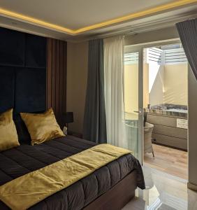 Postel nebo postele na pokoji v ubytování Domus Boutique Hotel