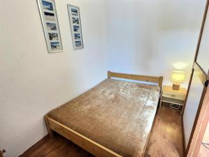 Posteľ alebo postele v izbe v ubytovaní Résidence Rond-point Des Pistes Iii - Appartement 2 pièces pour 4 personnes situé à Val d’Isère, skis aux pieds et à 500m du centre du village, navettes gratuites au MAE-1798