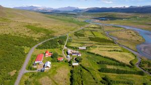 an aerial view of a farm with a river at H&oacute;tel &Aacute; in Reykholt