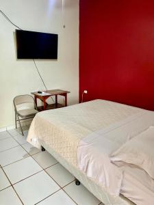 Postel nebo postele na pokoji v ubytování Aparta Hotel Palmerola