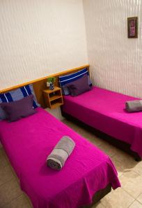 Ένα ή περισσότερα κρεβάτια σε δωμάτιο στο EcoHotelTDF