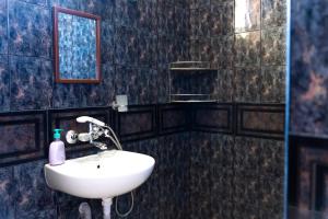 a bathroom with a sink and a mirror at Family House Katerini in Nesebar +13 photos