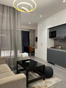 a living room with a couch and a coffee table at Santushti by Urban Retreat in Noida