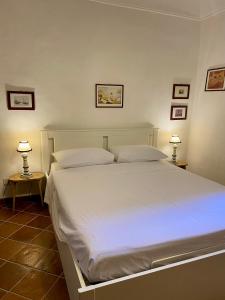 Postel nebo postele na pokoji v ubytování B&B Le Rondini - Sirolo