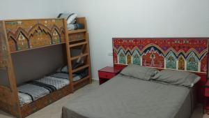 Postel nebo postele na pokoji v ubytování Hotel Al Andalous