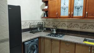 Kuchyň nebo kuchyňský kout v ubytování Hotel Al Andalous