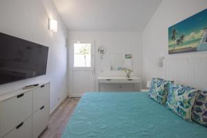 TV/Unterhaltungsangebot in der Unterkunft Playa del Aguila Bungalow con Terraza Solarium