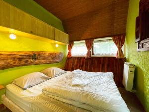 Postel nebo postele na pokoji v ubytování Chalets des Trois Hêtres