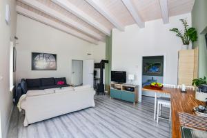 a living room with a couch and a table at Rosemary Apartment in Bratislava
