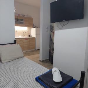 a room with a bed with a computer mouse on a tray at small STUDIO center 2 in Thessaloniki