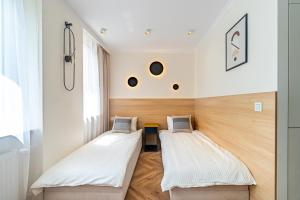 Postel nebo postele na pokoji v ubytování Apartament Hotelowy, Klimatyzacja, PW INVEST HOME