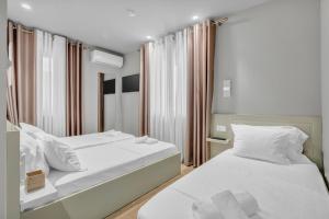 Letto o letti in una camera di Villa Zoi A Stay to Remember I Located inside the Castle of Elbasan, on a historic Roman road Via Egnatia I Homemade Breakfast