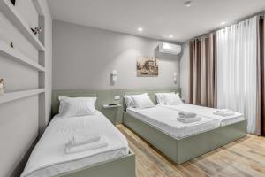 Letto o letti in una camera di Villa Zoi A Stay to Remember I Located inside the Castle of Elbasan, on a historic Roman road Via Egnatia I Homemade Breakfast