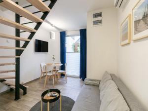 a living room with a couch and a table at Holiday Home in Niechorze near Baltic Beach in Niechorze