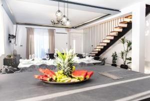 a plate of fruit on a table in a restaurant at Apartment Jasna in Splitska