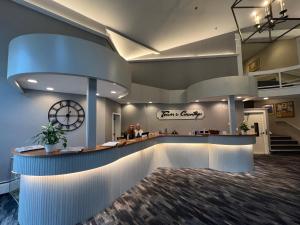 a lobby of a dental office with a clock on the wall at Town & Country Inn & Resort in Gorham