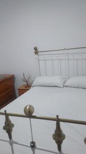 Una cama o camas en una habitación de Apartamento Loft con vistas al mar y ciudad