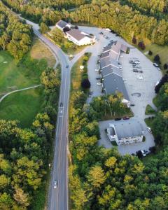 an aerial view of a parking lot and a road at Town & Country Inn & Resort in Gorham