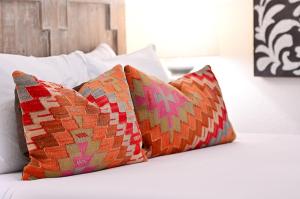two pillows sitting on top of a bed at Tesuque Outpost Casita F Best views in Santa Fe in Santa Fe