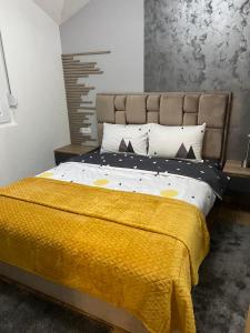 Postel nebo postele na pokoji v ubytování SOUL Apartman