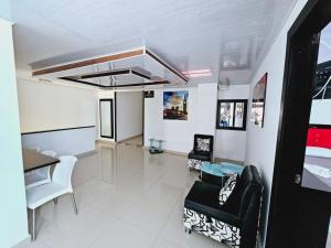 a living room with chairs and a table at HOTEL BIG BEN MALAGA SANTANDER in Málaga +10 photos