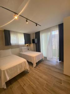 Katil atau katil-katil dalam bilik di Çağdaş Otel