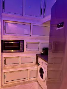 Cucina o angolo cottura di Palmeraie 5 Vue Piscine et Jardin