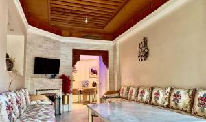 TV o dispositivi per l'intrattenimento presso Palmeraie 5 Vue Piscine et Jardin