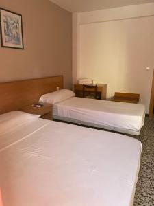 Postel nebo postele na pokoji v ubytování Hotel Iris