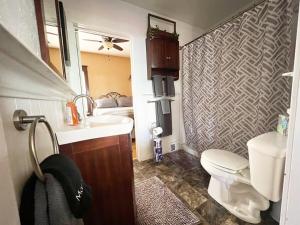 a small bathroom with a sink and a toilet at Hill City Haven Downtown Main Street in Hill City +54 photos