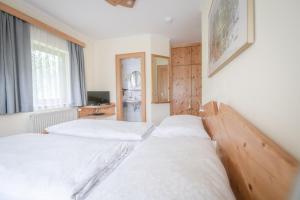 Postel nebo postele na pokoji v ubytování Gästehaus Maurer/Bader