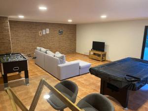 a living room with a couch and a table at Quinta O Cabecinho in Torres Novas