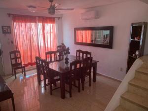 a dining room with a table and chairs at Casa Intensamente in Jesús María