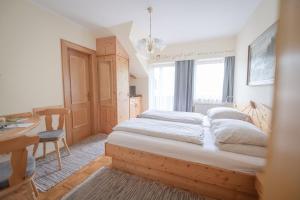 Postel nebo postele na pokoji v ubytování Gästehaus Maurer/Bader