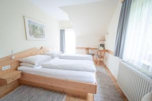 Postel nebo postele na pokoji v ubytování Gästehaus Maurer/Bader + 37 fotografií