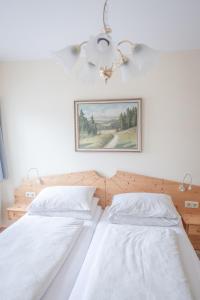 Postel nebo postele na pokoji v ubytování Gästehaus Maurer/Bader