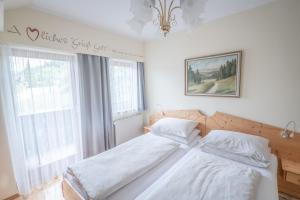 Postel nebo postele na pokoji v ubytování Gästehaus Maurer/Bader