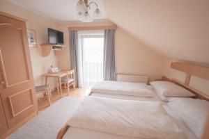 Postel nebo postele na pokoji v ubytování Gästehaus Maurer/Bader